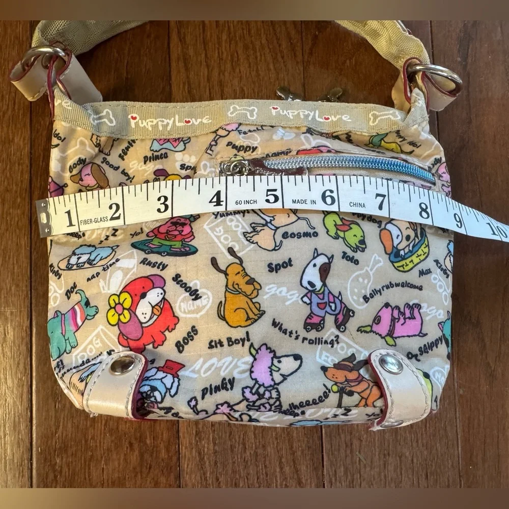 Puppy Love Purse with 2 top zippers and sm side zip.
Cream with bone zip pulls - Picture 4 of 10